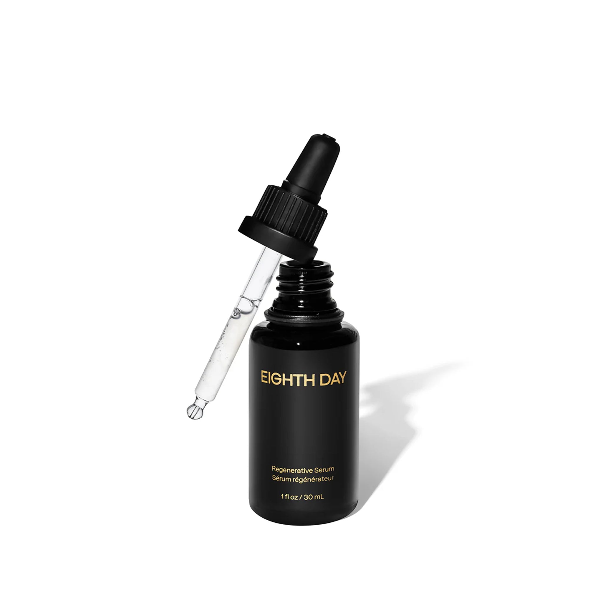 Black serum bottle with dropper labeled 'Eighth Day' on a white background