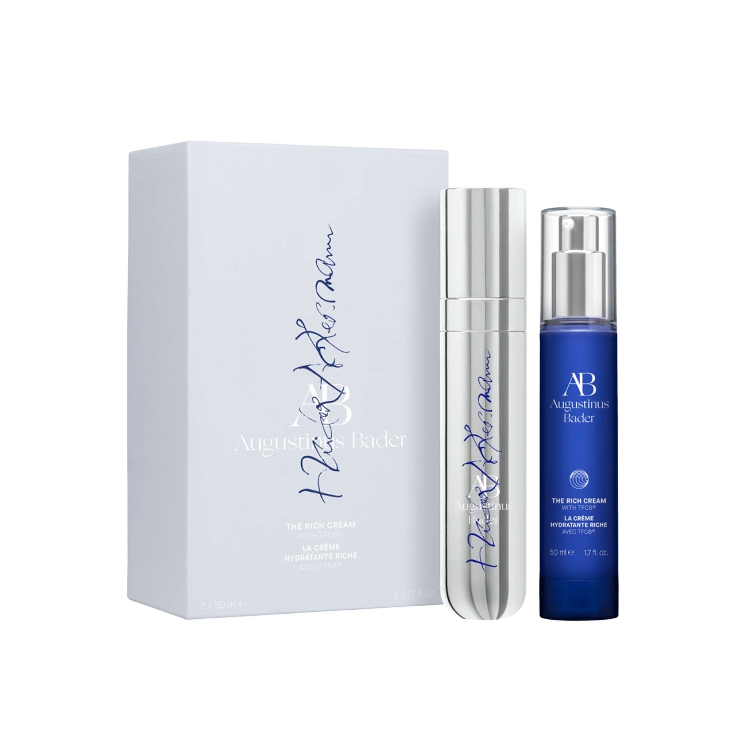 Two skincare bottles with a white box on a white background