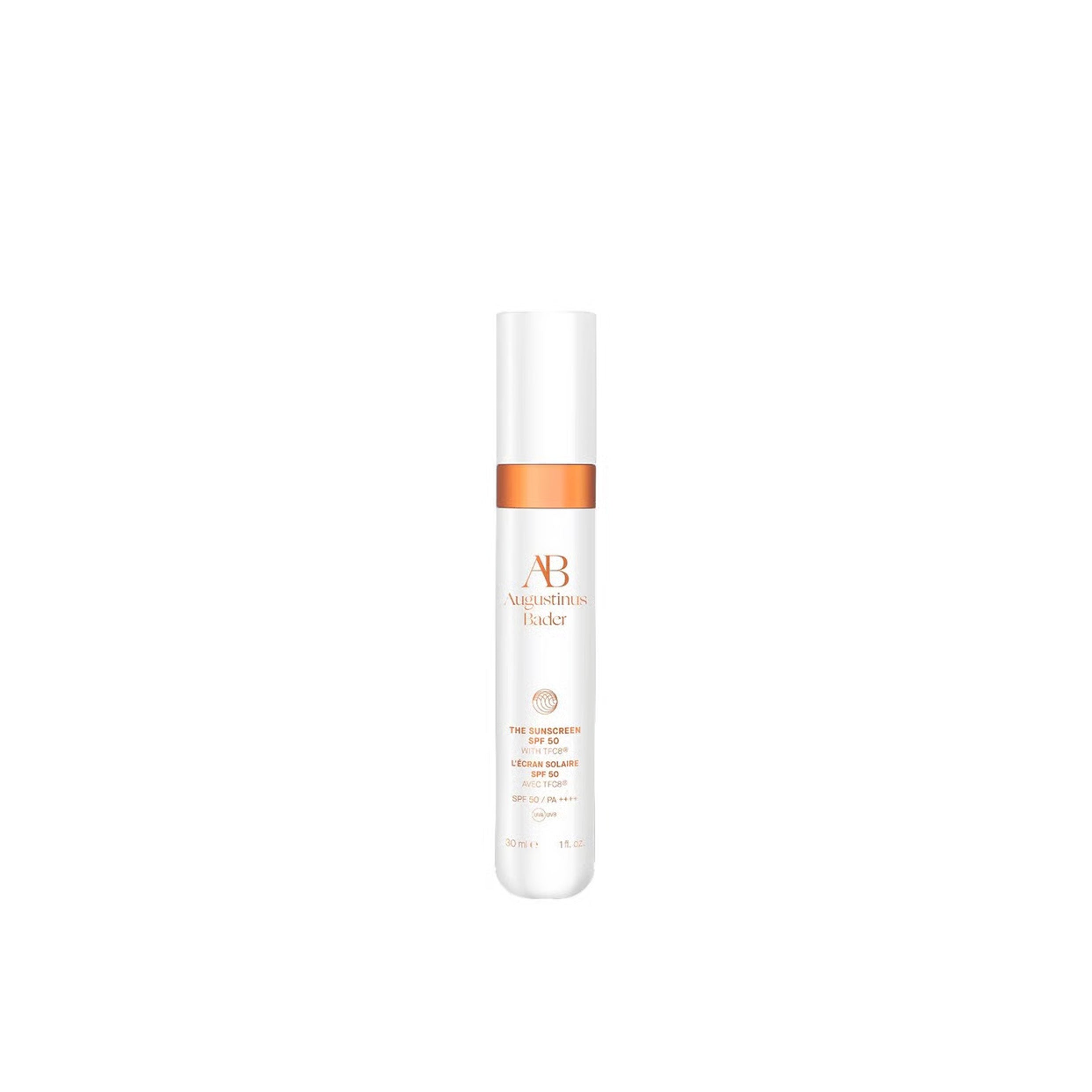 White skincare bottle with orange label on a white background