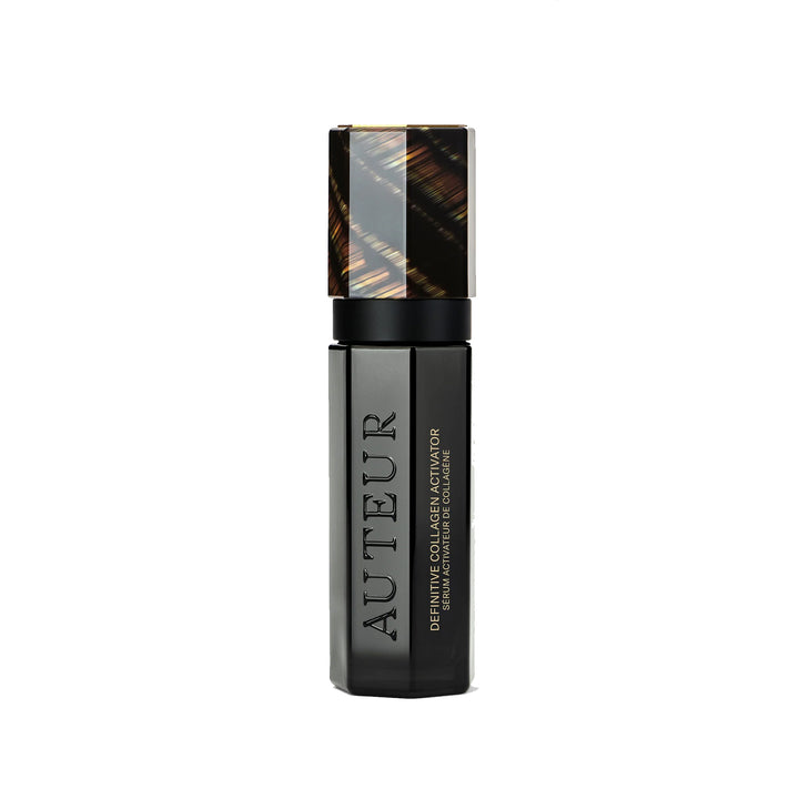 Auteur cosmetic serum bottle with black and gold design on a white background