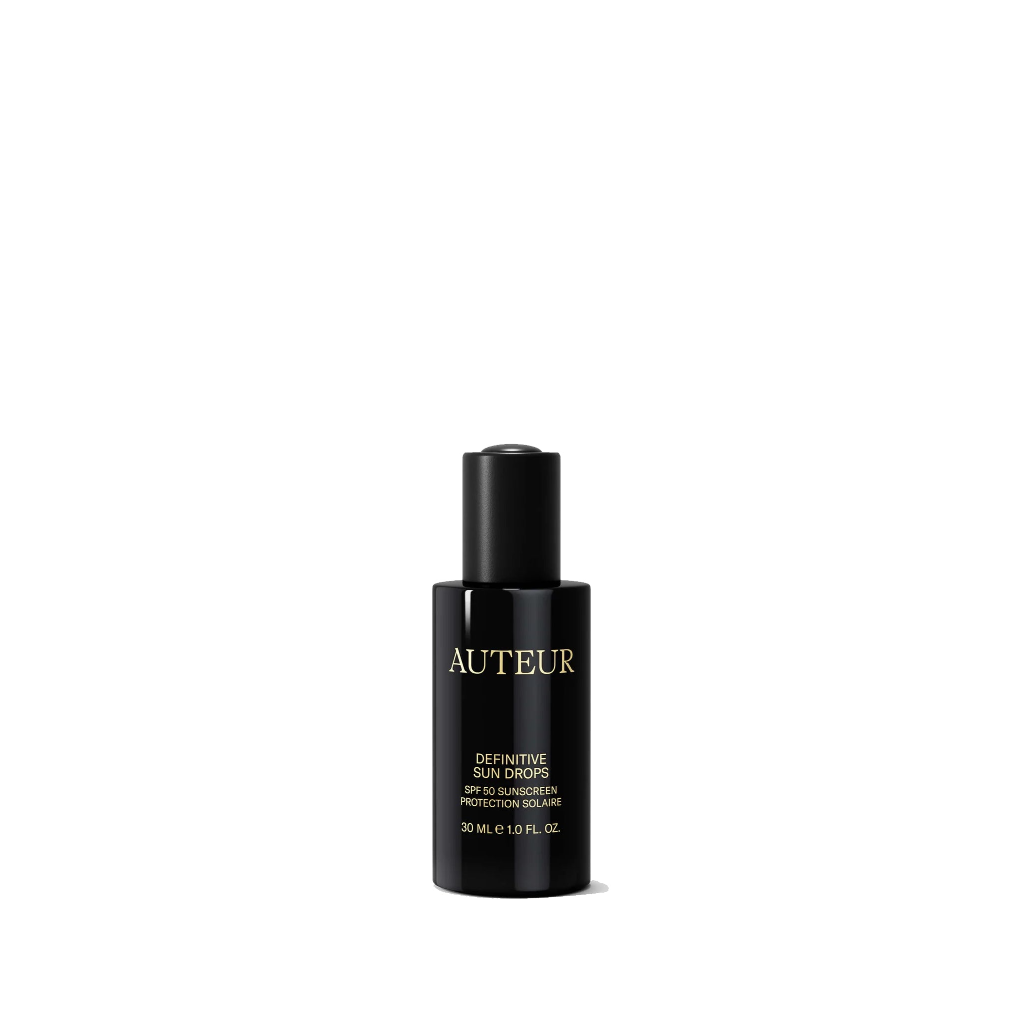 Black bottle of Auteur Definitive Sun Drops on a white background