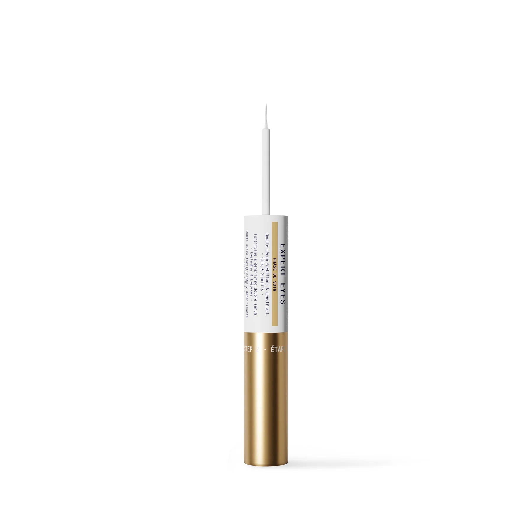 Gold and white cosmetic tube on a white background