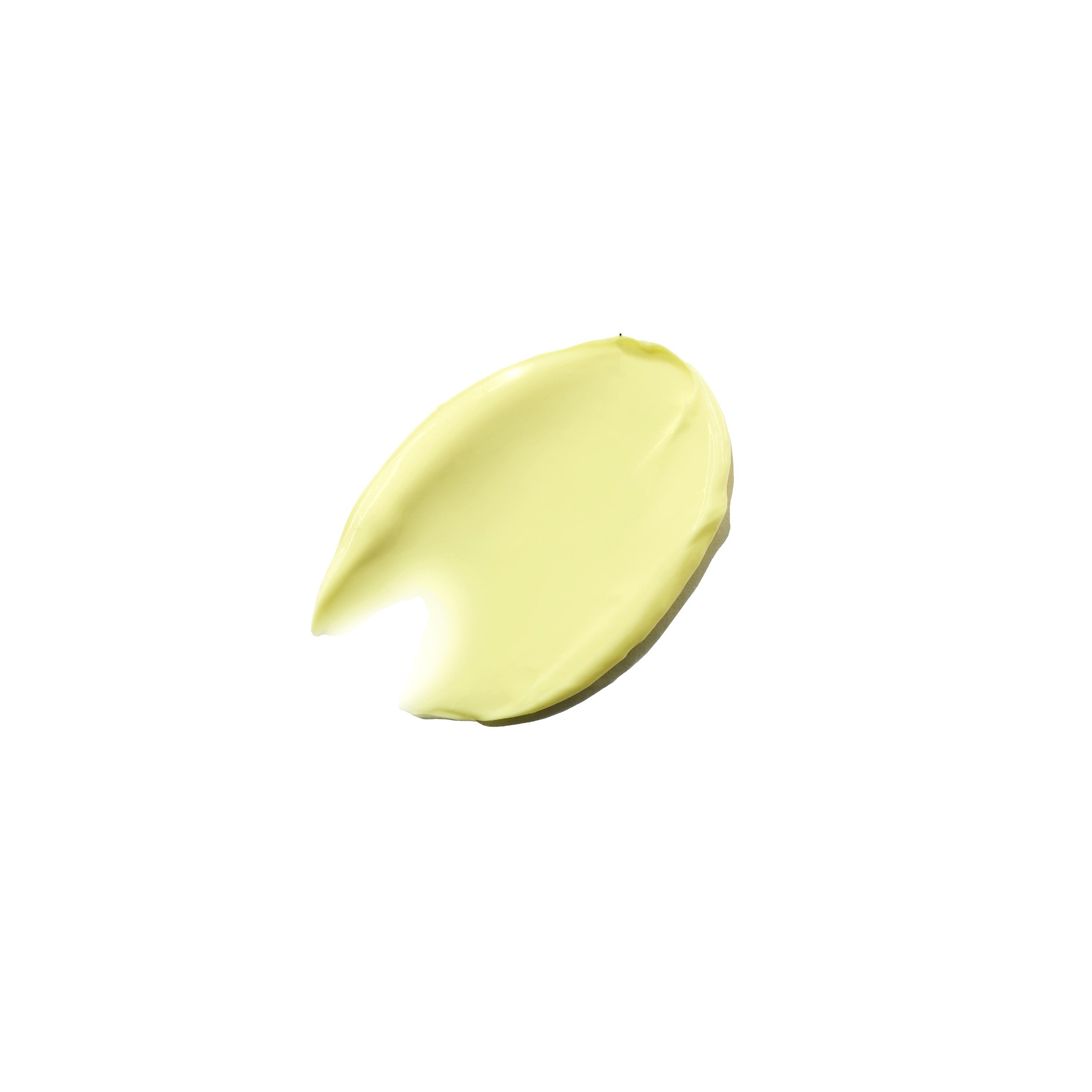 A product swatch of a night cream, showing a yellow colour
