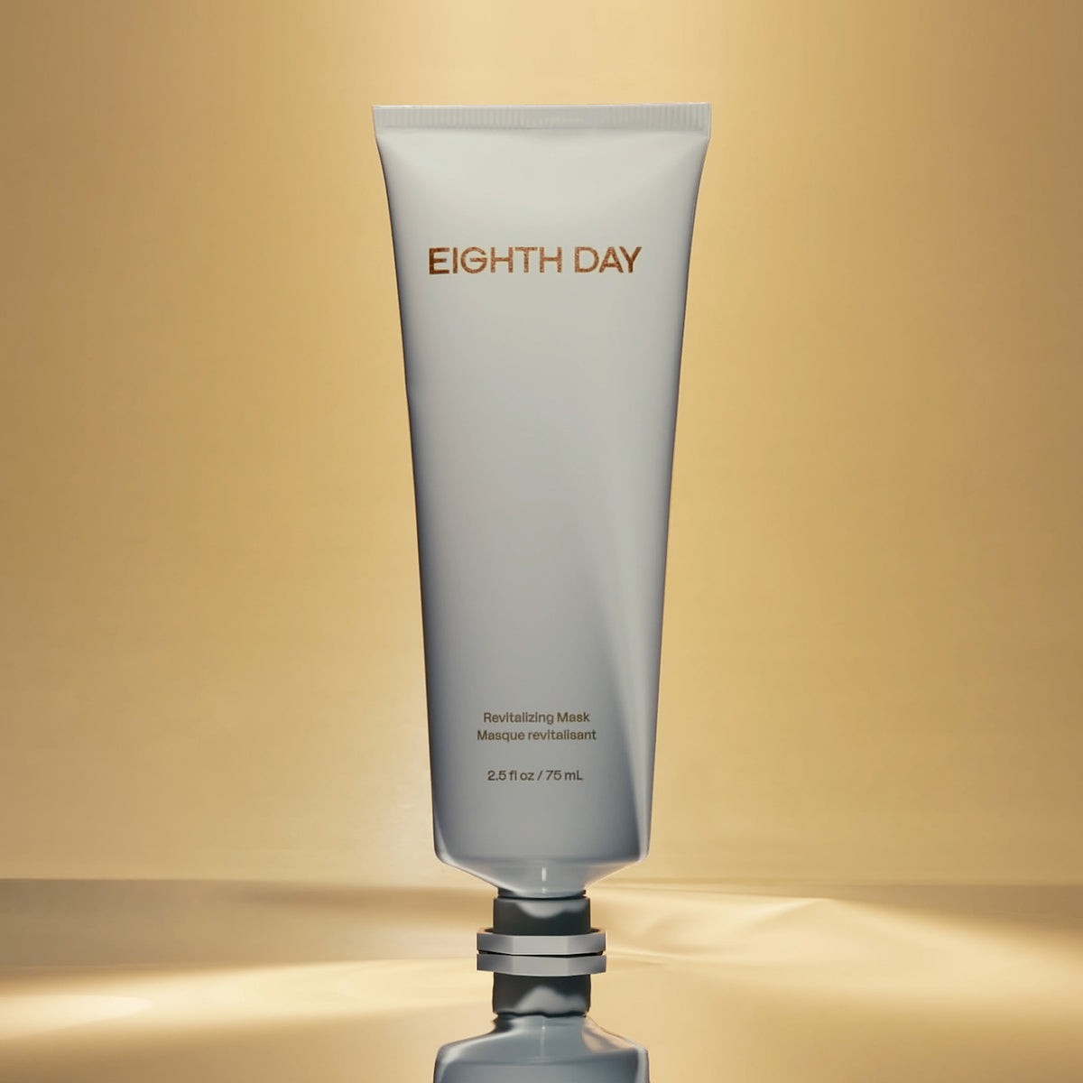 Eighth Day The Revitalizing Mask silver tube on a gold background