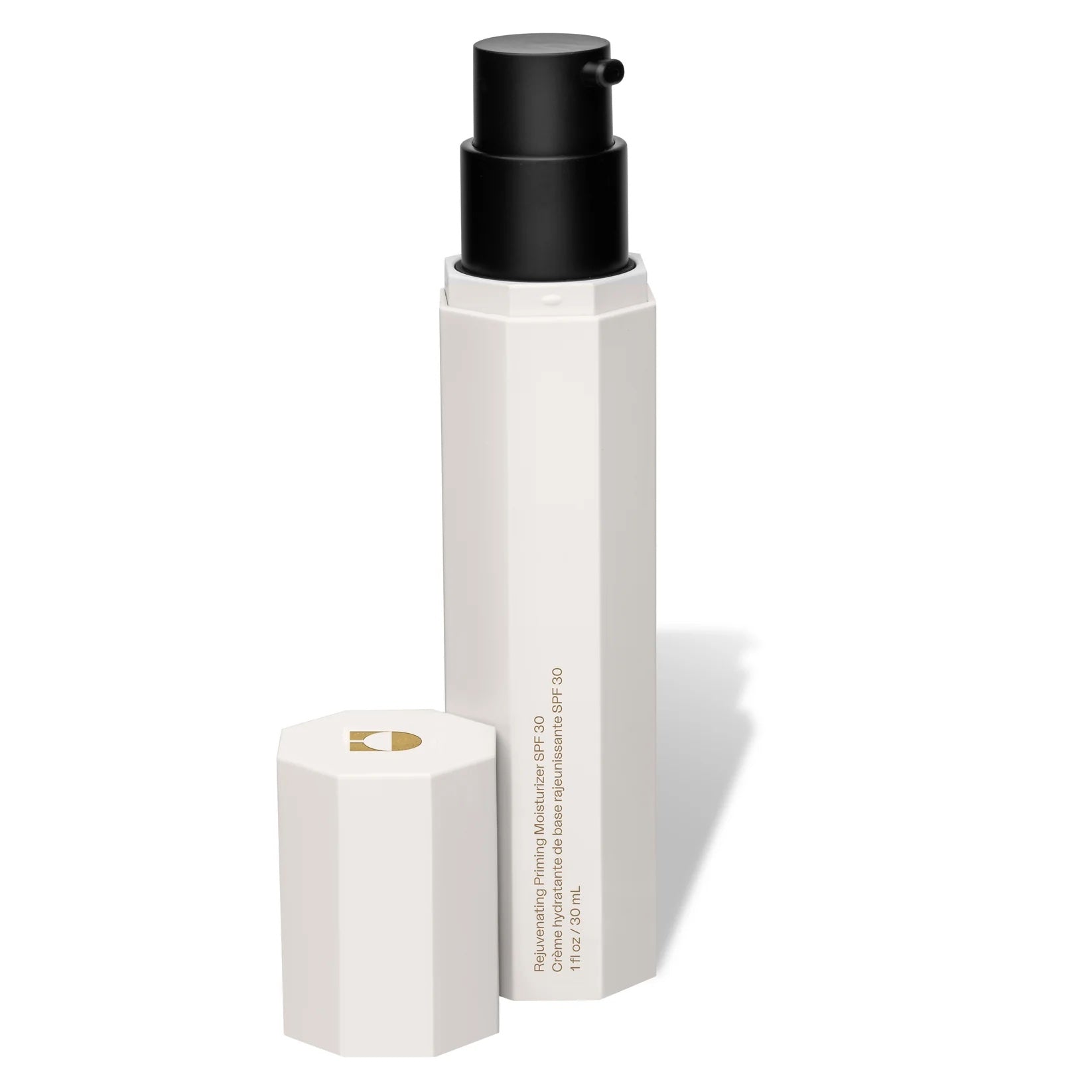 White cosmetic bottle with black cap on a white background