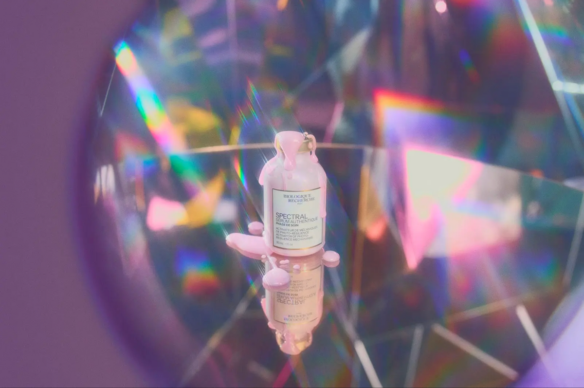 Biologique Recherche Serum Spectral bottle on a prismatic mirrored surface