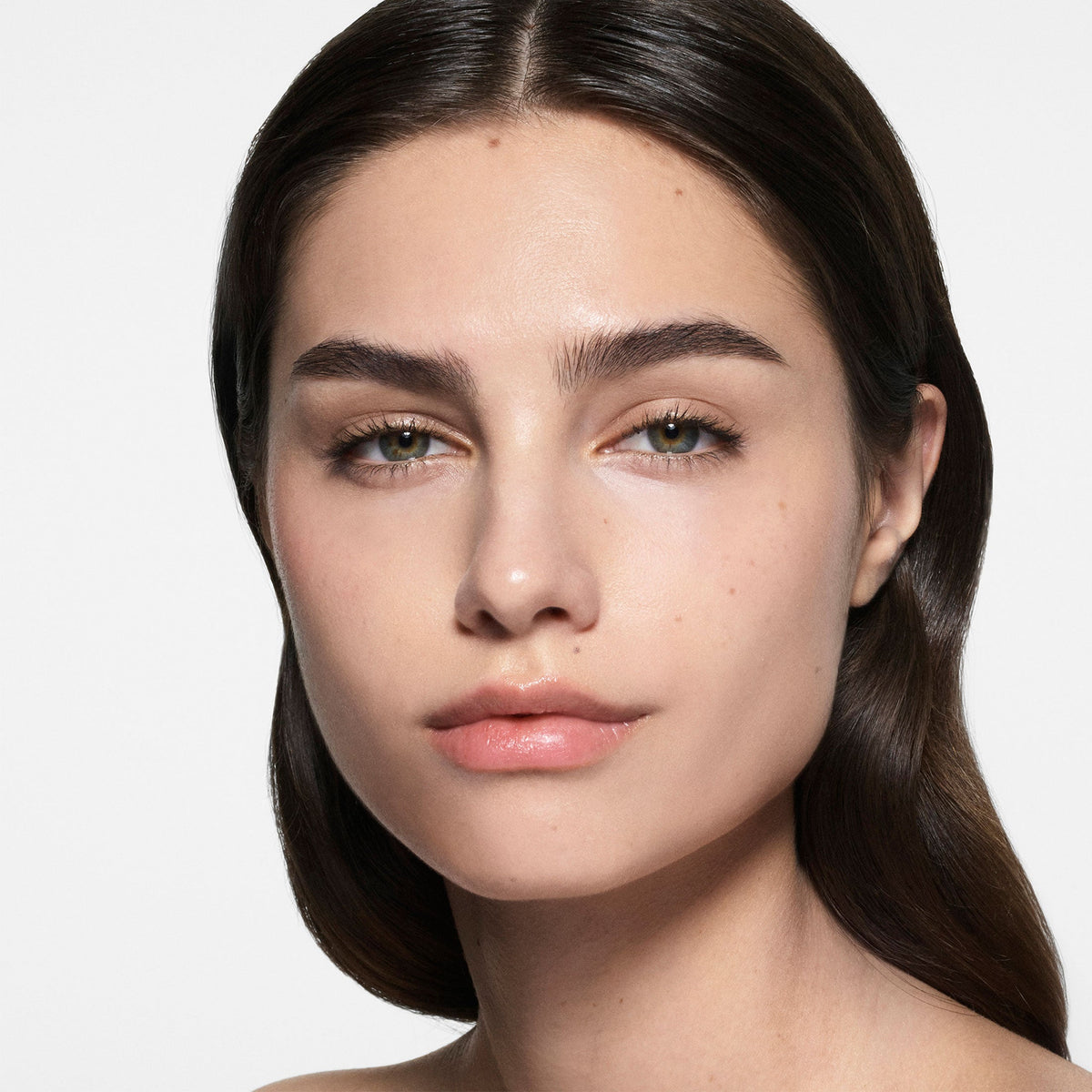 Model wearing Victoria Beckham Beauty The Foundation Drops in shade 4 Light