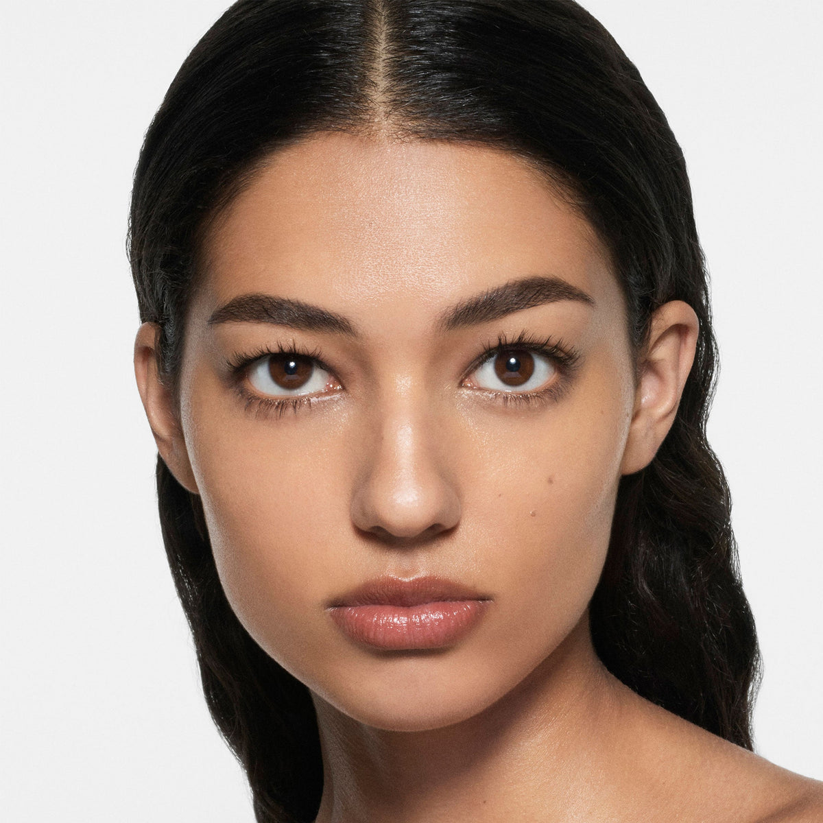 Model wearing Victoria Beckham Beauty The Foundation Drops in shade 6 Light Medium