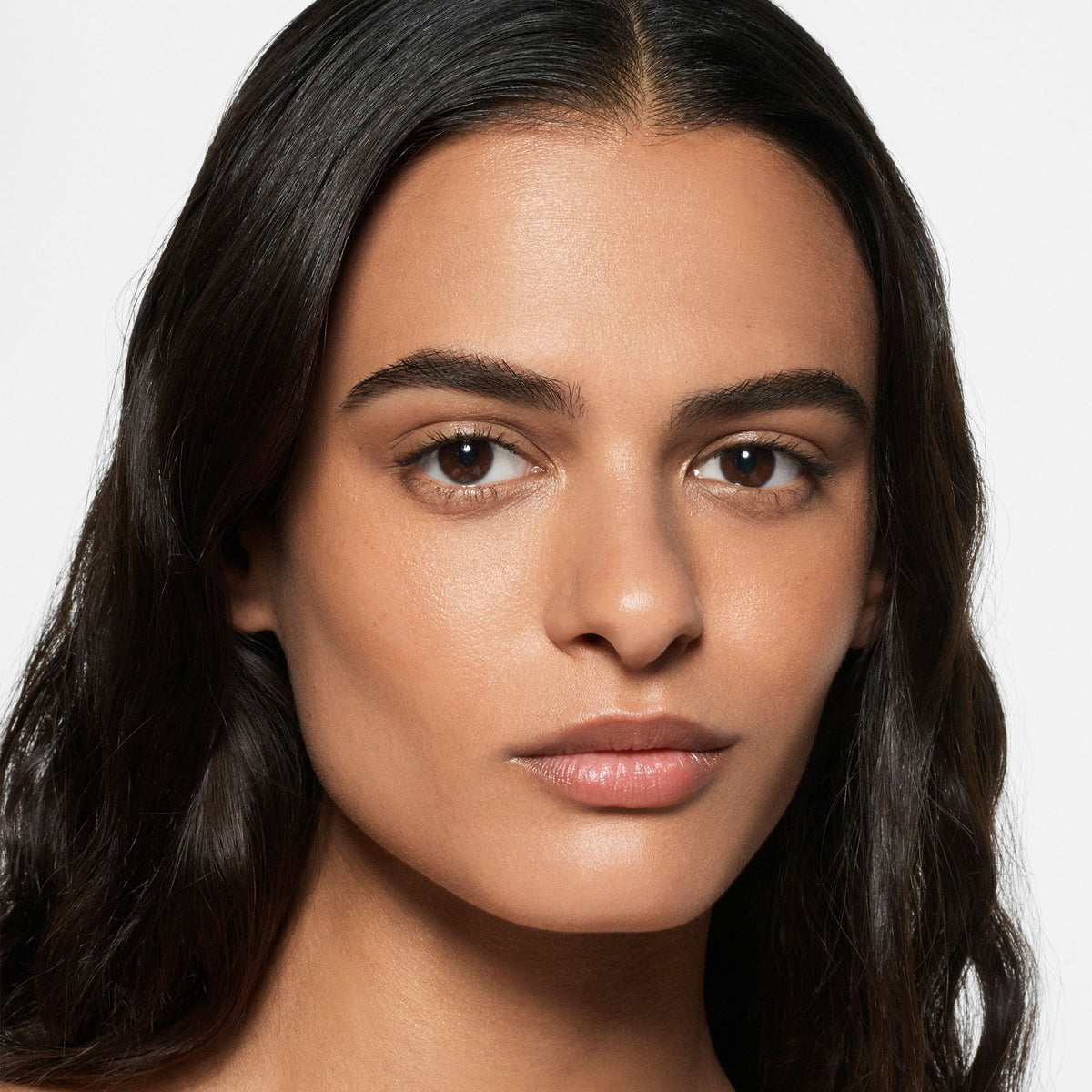 Model wearing Victoria Beckham Beauty The Foundation Drops in shade 8 Medium