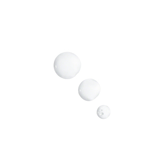 Droplets of Valmont Moisturizing Booster, showing a white liquid