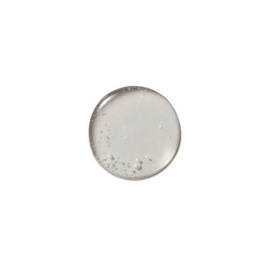 A product sample of Victoria Beckham Beauty Oil Cleanser, showing an oily texture.