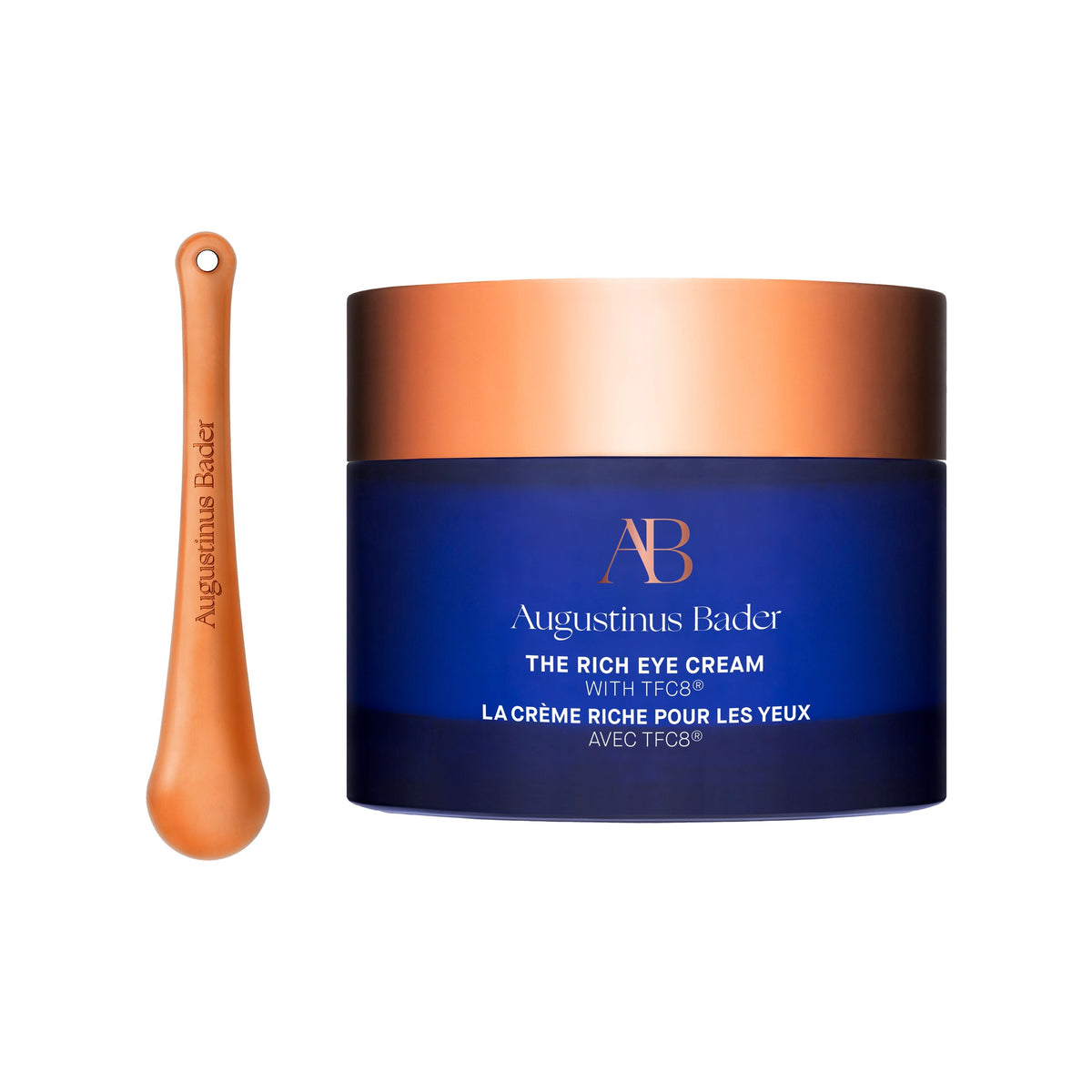 Augustinus Bader The Rich Eye Cream blue jar with copper lid, beside its copper applicator