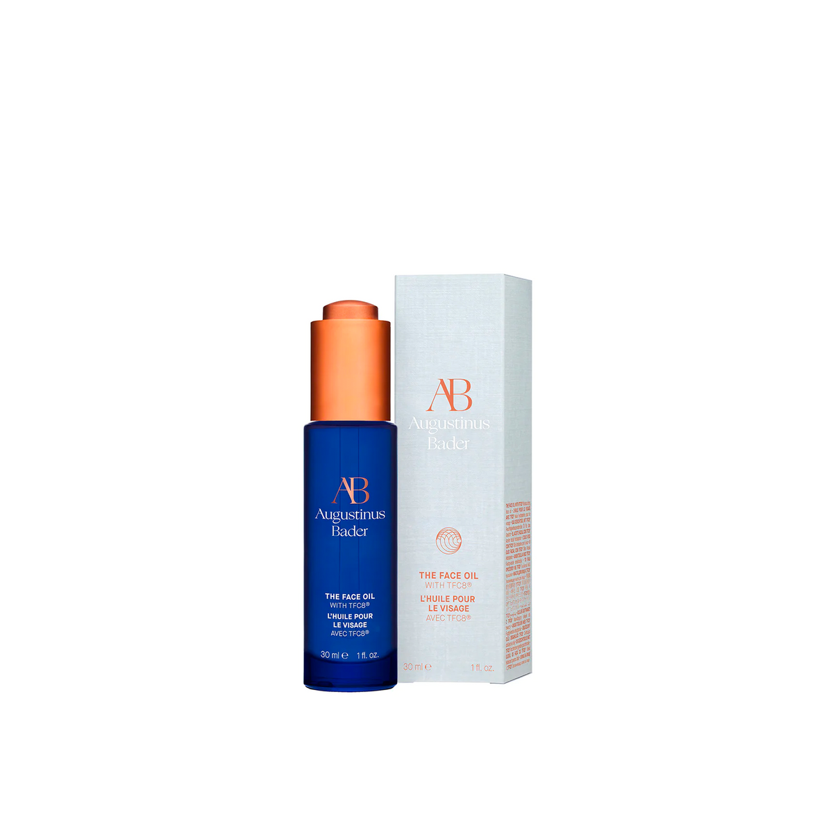 Augustinus Bader The Face Oil, shown next to it's box papckaging.