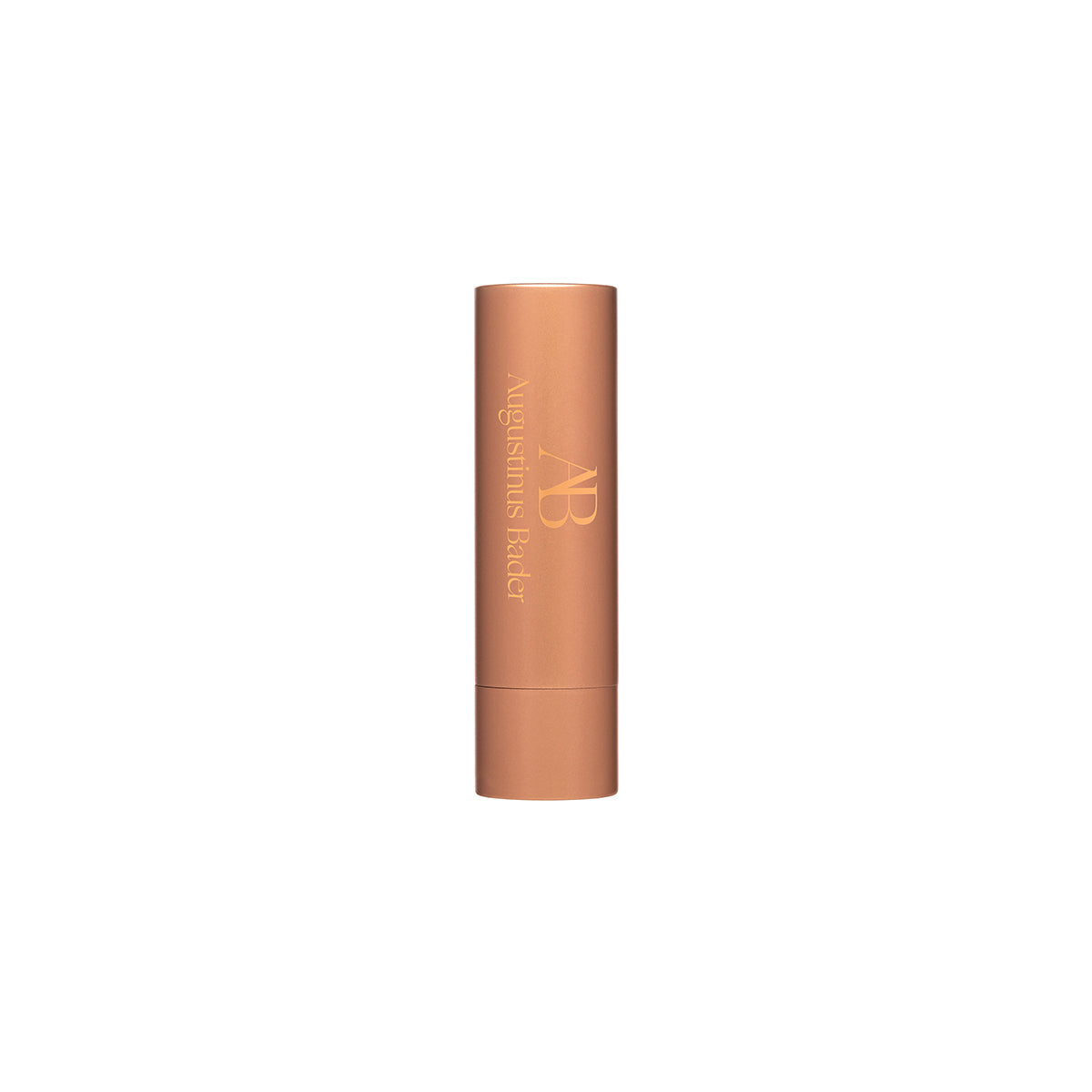 A tube of Augustinus Bader The Lip Balm in bronze packaging.