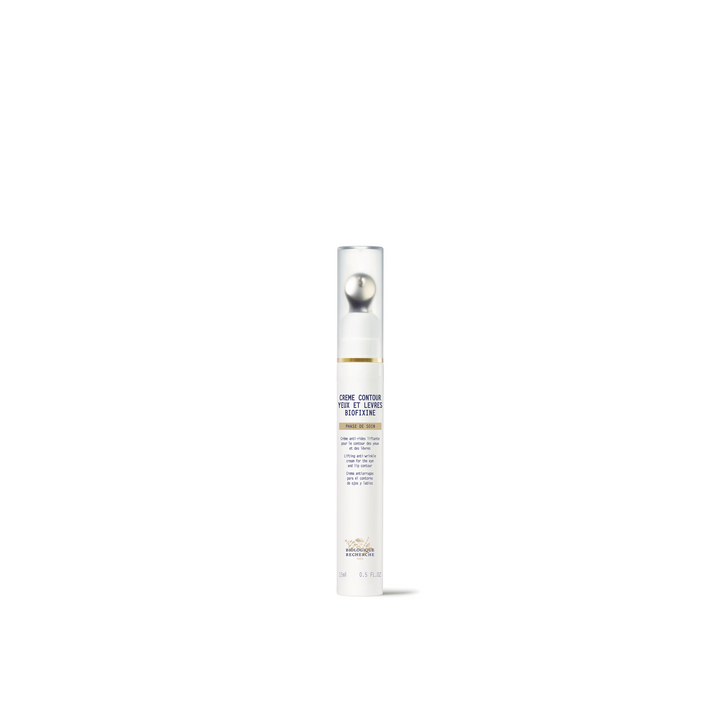 A white bottle with a pump dispenser labeled Biologique Recherche Crème Contour Yeux et Lêvres Biofixine.
