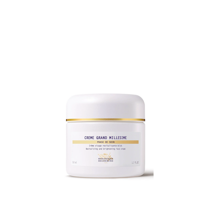 A jar of Biologique Recherche Crème Grand Millésime with a white and gold label on a white background.