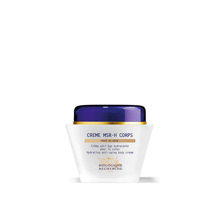 A white jar with a blue lid containing the Biologique Recherche Crème MSR-H Corps body cream, labeled for hydrating and regenerating mature skin.