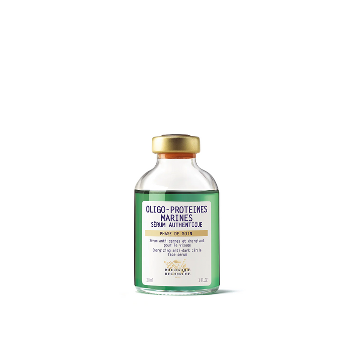 A bottle of Biologique Recherche Serum Oligo-Protéines Marines with a white label, green text, and a gold cap.