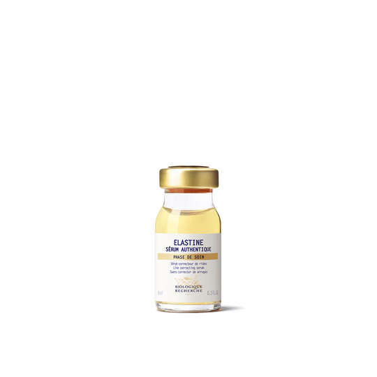 A clear glass vial with a white label, containing the Biologique Recherche Serum Elastine.