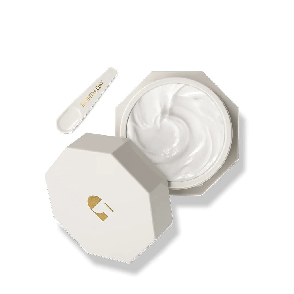 A plastic jar of Eighth Day The Intensive Moisturiser, displaying the contents with lid off