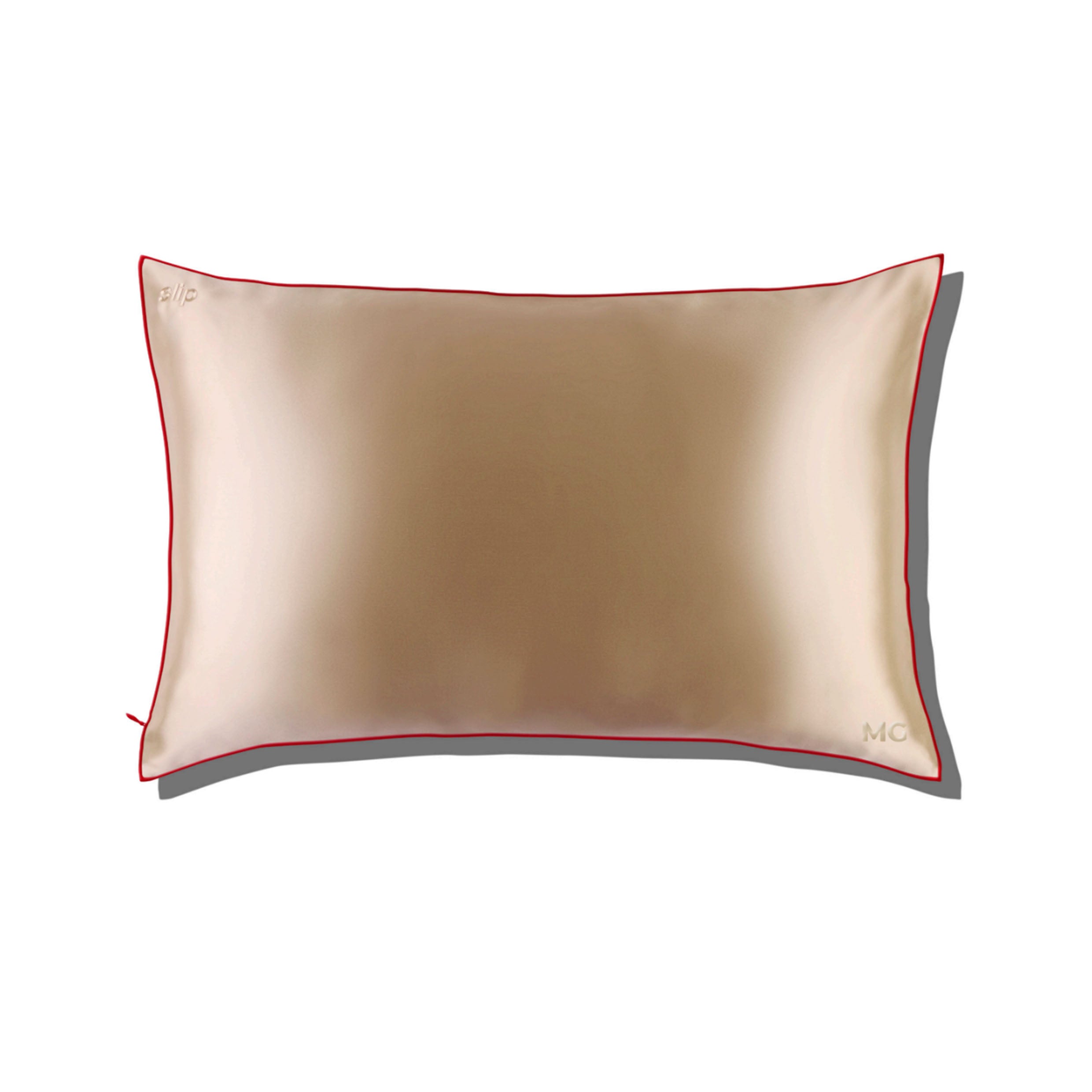 A beige silk pillowcase with a red trim and a visible zipper.