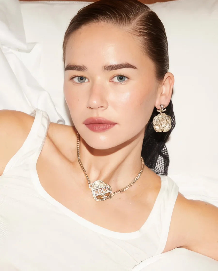 Portrait from Melanie Grant, wearing floral earrings